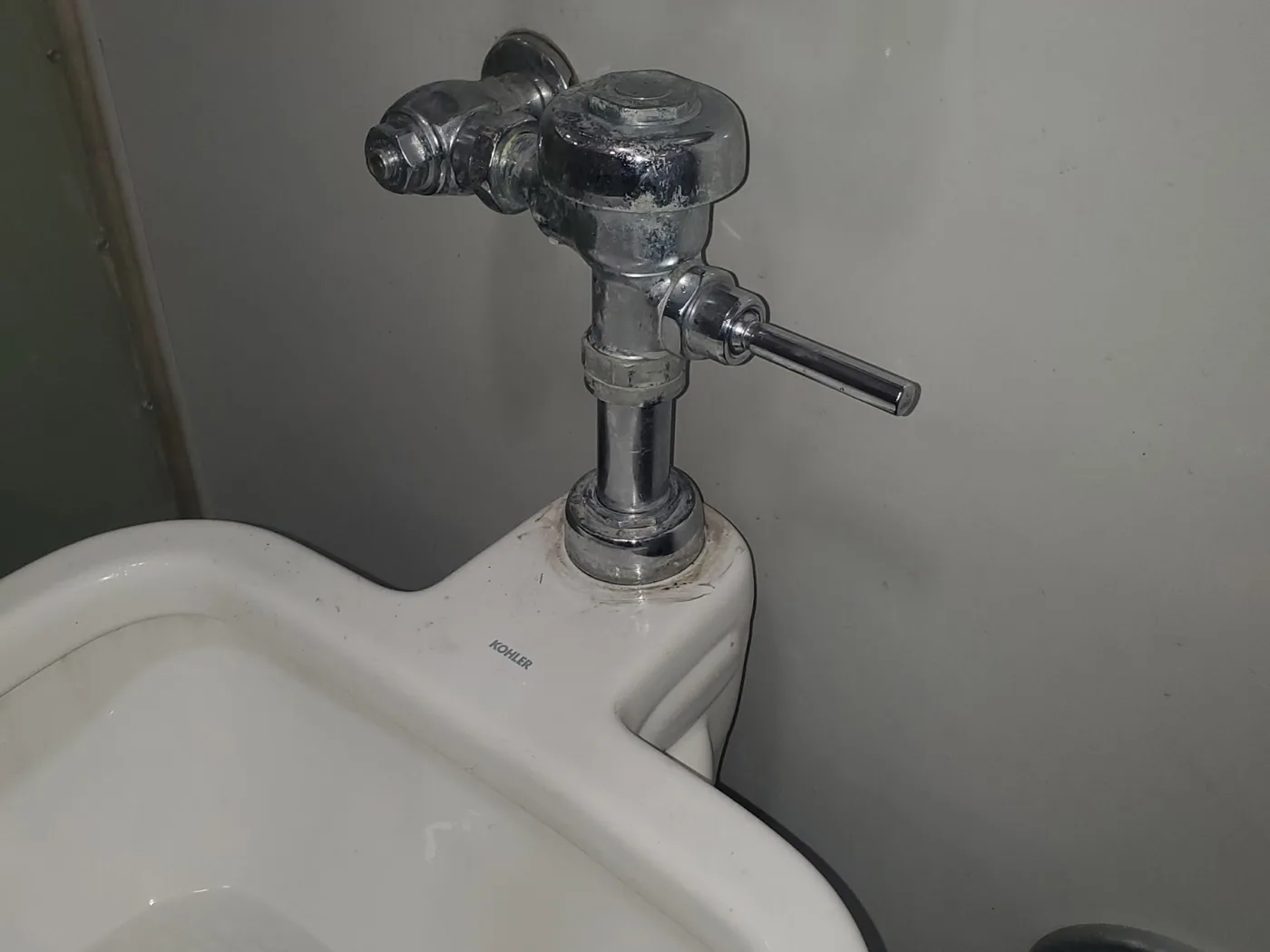 After: The same sink with a new chrome flush valve and clean supply lines